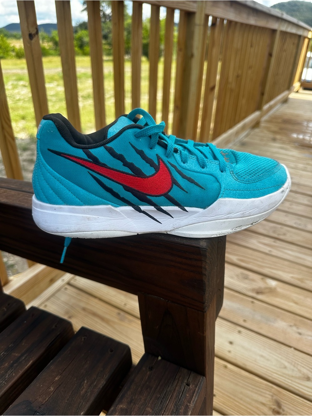 Ja Morant Nike Teal Athletic Shoes with Red Swoosh and Black Accents